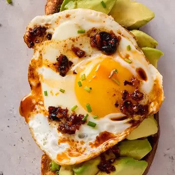 Fly By Jing Sichuan Chili Crisp Chili Oil on Egg Avocado Toast